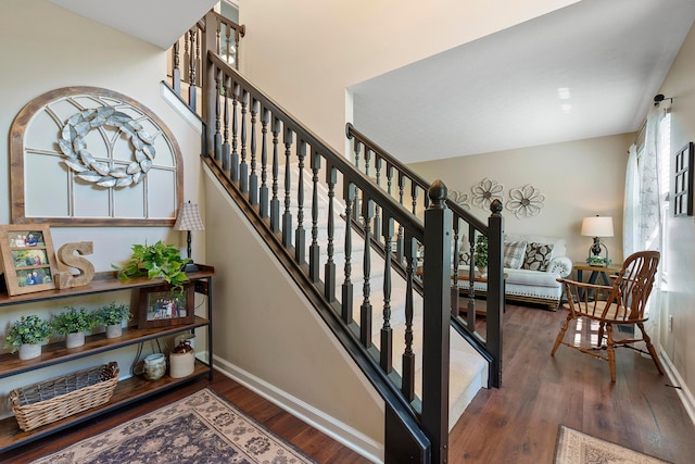 stairs with hardwood / wood-style floors