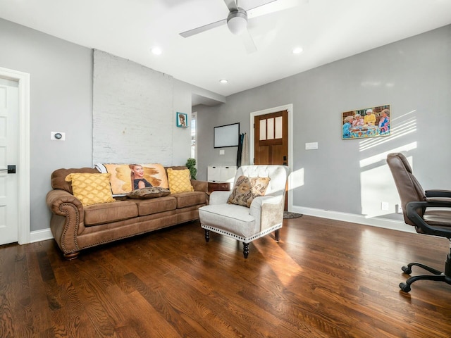 living room featuring ceiling fan and wood-type flooring