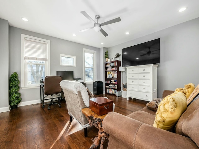 living room featuring ceiling fan and dark wood-type flooring