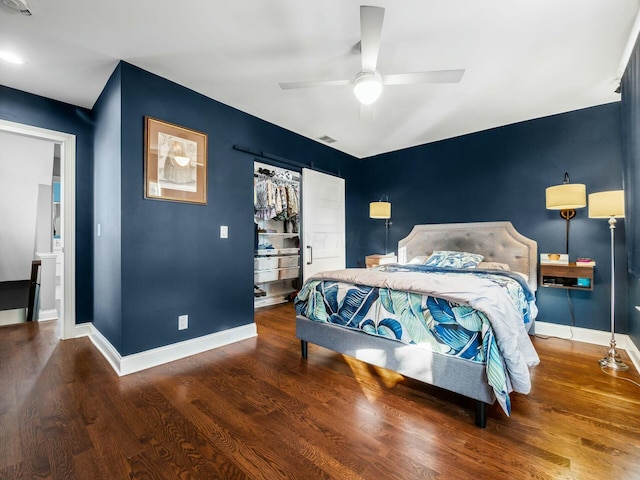 bedroom with ceiling fan, wood-type flooring, and a closet