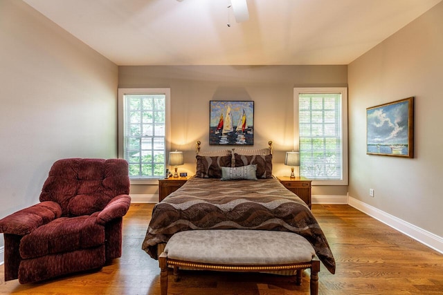 bedroom featuring hardwood / wood-style flooring and ceiling fan