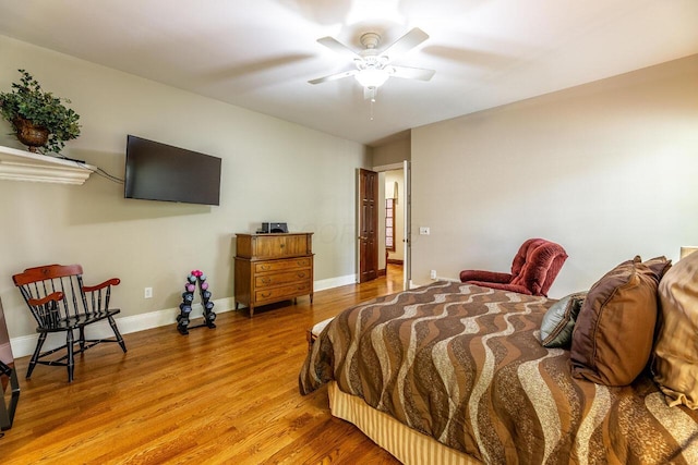 bedroom with hardwood / wood-style flooring and ceiling fan