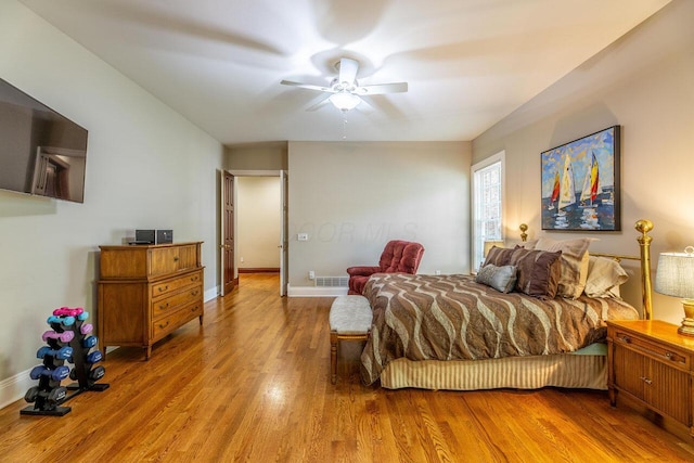 bedroom featuring ceiling fan and light hardwood / wood-style flooring