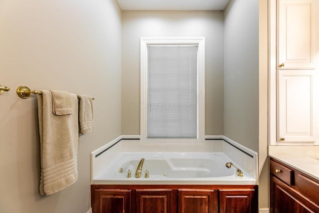 bathroom featuring a bathing tub and vanity