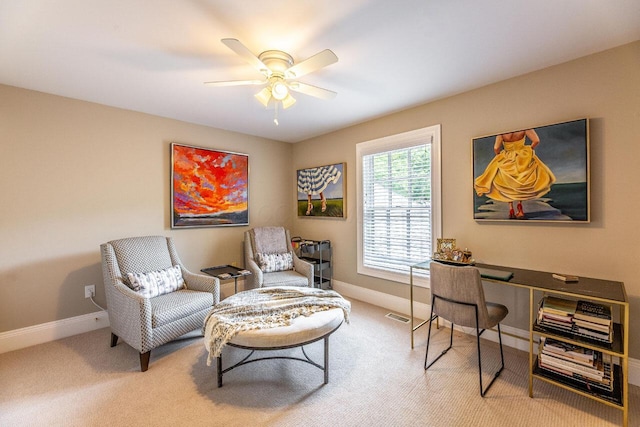 sitting room featuring carpet flooring and ceiling fan