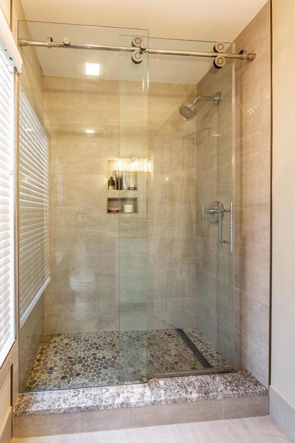 bathroom featuring an enclosed shower