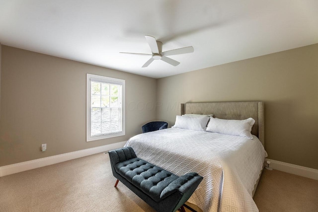 bedroom with ceiling fan and light carpet