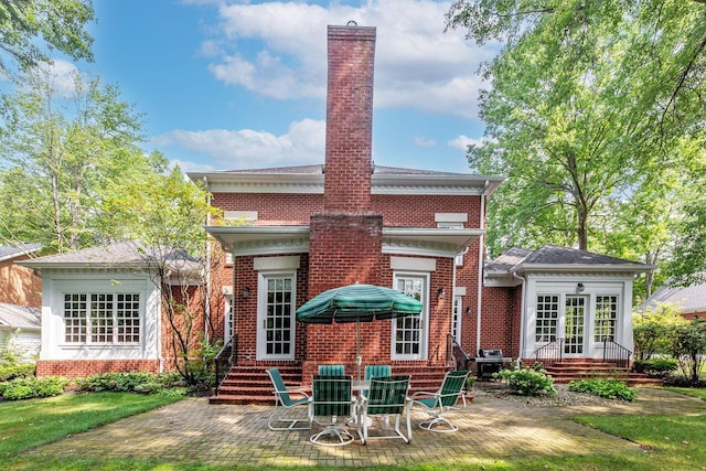 rear view of house featuring a patio area