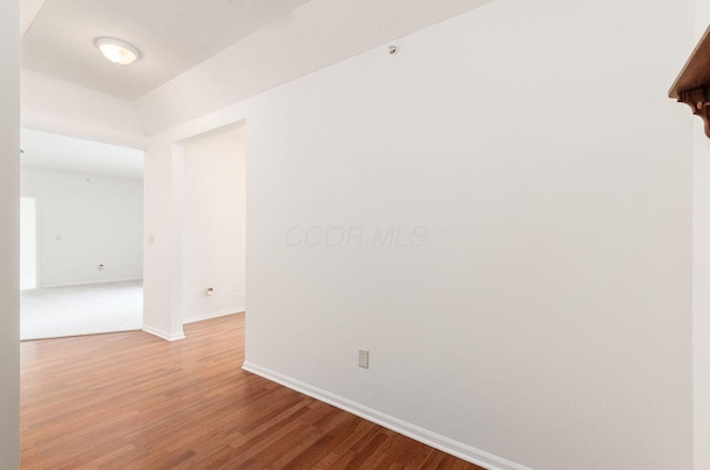 unfurnished room with hardwood / wood-style floors