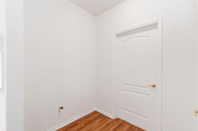 unfurnished room featuring hardwood / wood-style flooring