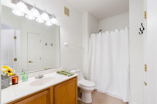 bathroom featuring vanity, a shower with shower curtain, and toilet