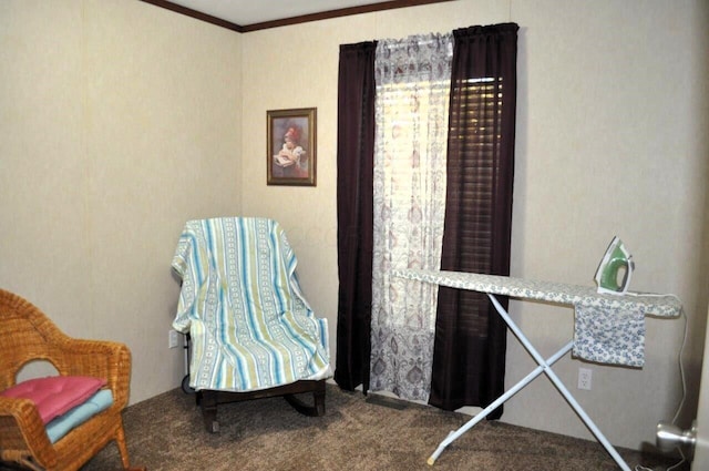 sitting room with carpet and ornamental molding