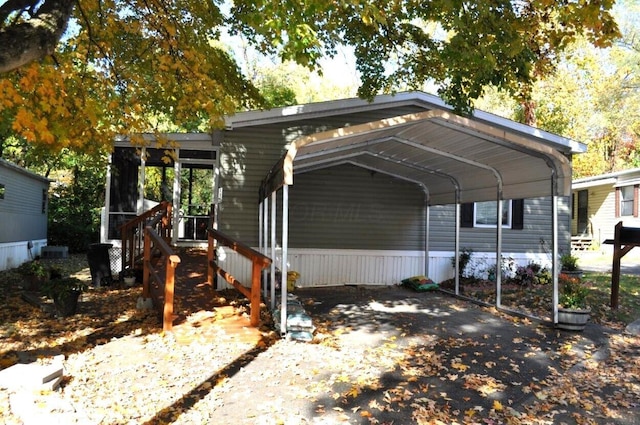 exterior space with a carport