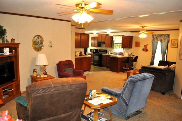 carpeted living room with ceiling fan and ornamental molding