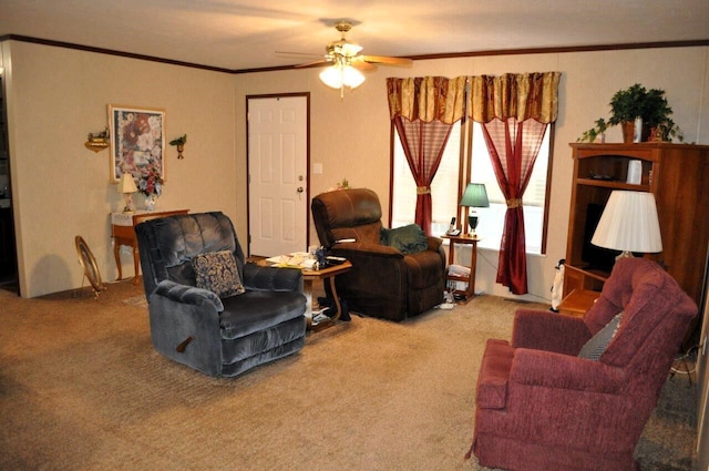 living room featuring carpet, ceiling fan, and ornamental molding