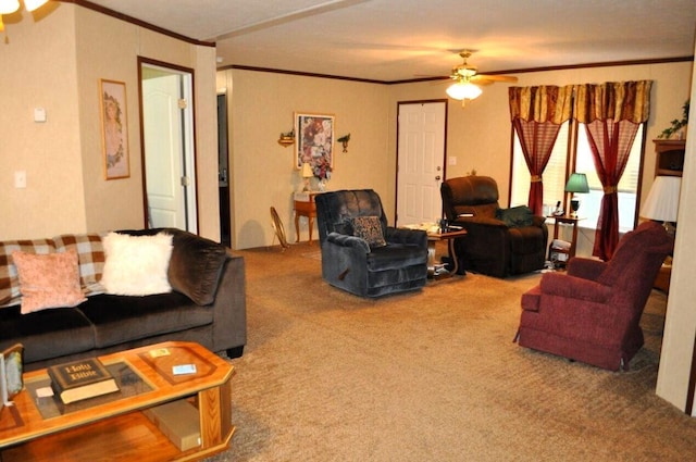 carpeted living room with ceiling fan and ornamental molding