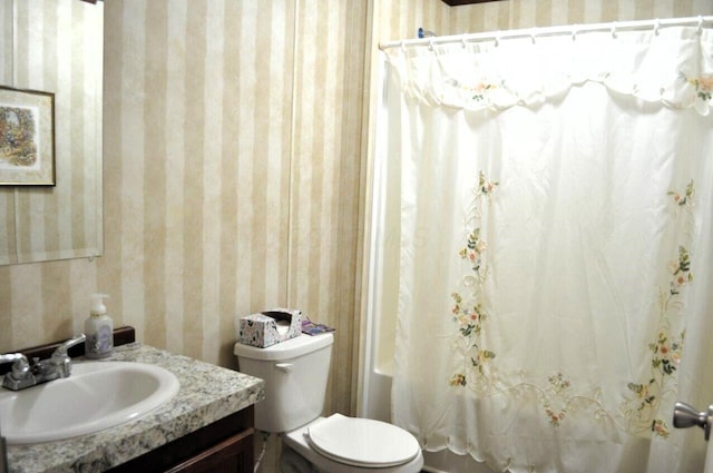 full bathroom featuring vanity, toilet, and shower / bath combo with shower curtain