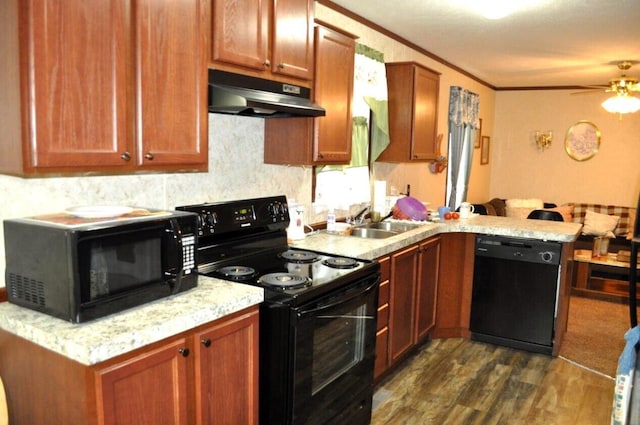 kitchen featuring kitchen peninsula, ceiling fan, dark wood-type flooring, sink, and black appliances