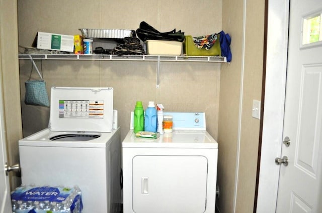 clothes washing area with independent washer and dryer