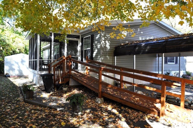 exterior space with a sunroom