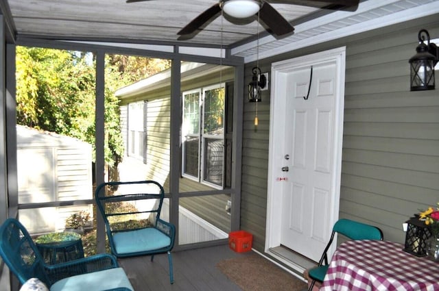 entrance to property with ceiling fan