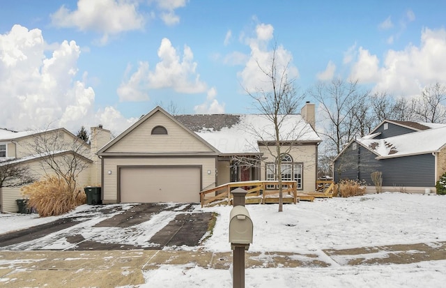 view of front of home featuring a garage and a deck