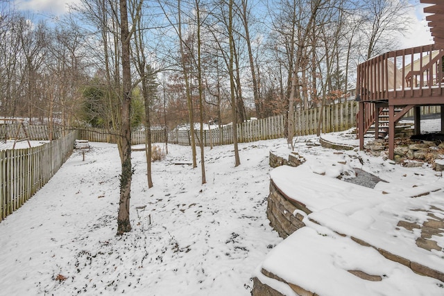 view of yard layered in snow