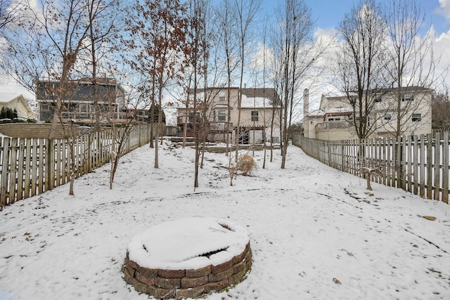 view of yard layered in snow