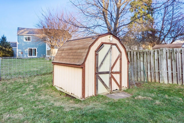 view of outbuilding with a lawn