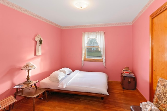 bedroom featuring wood-type flooring