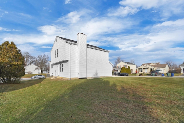 view of property exterior featuring a yard