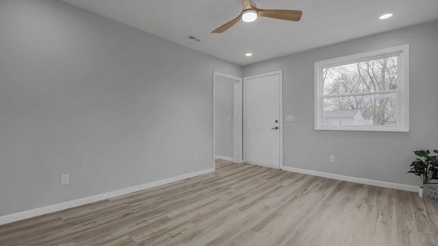 unfurnished room featuring ceiling fan and light hardwood / wood-style flooring