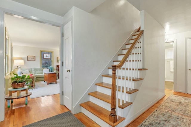 stairway featuring hardwood / wood-style flooring