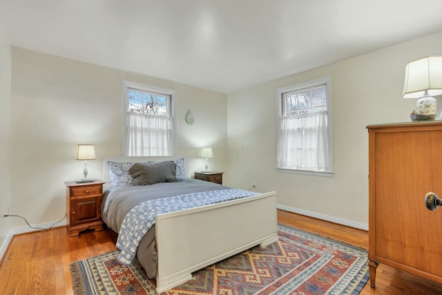 bedroom with hardwood / wood-style flooring