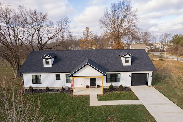 modern inspired farmhouse with a front lawn