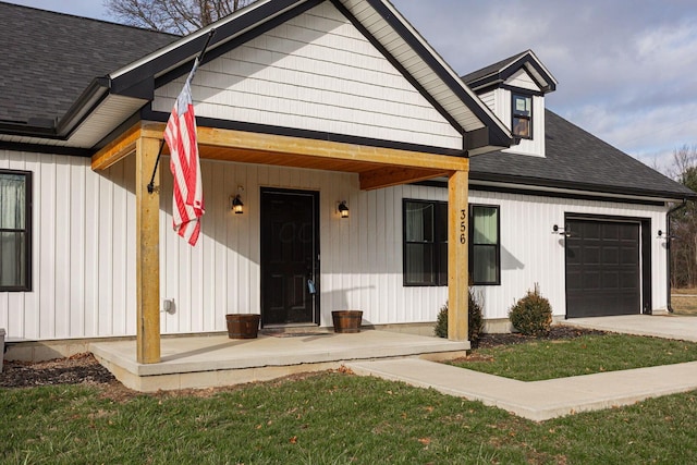 view of front of property featuring covered porch and a garage