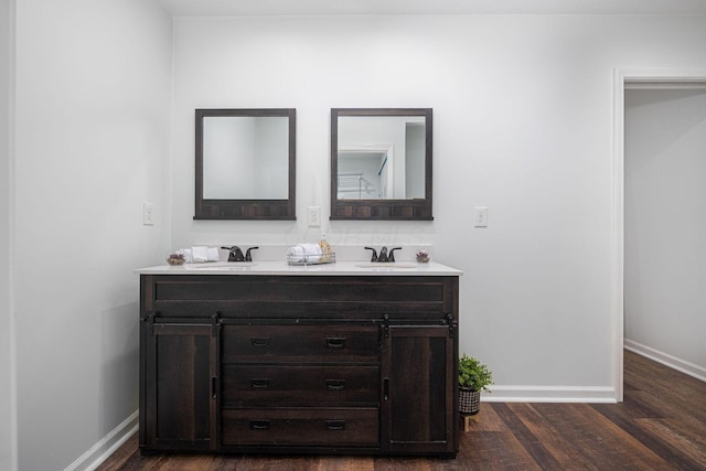 bathroom featuring hardwood / wood-style flooring and vanity