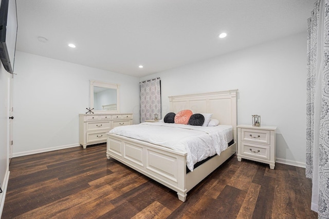 bedroom featuring dark hardwood / wood-style flooring