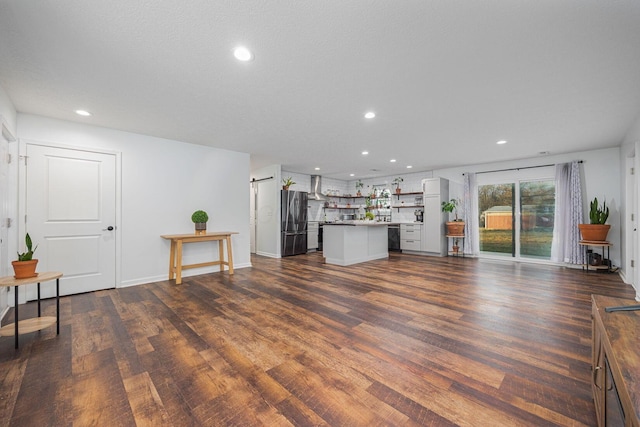 living room with bar and dark hardwood / wood-style flooring