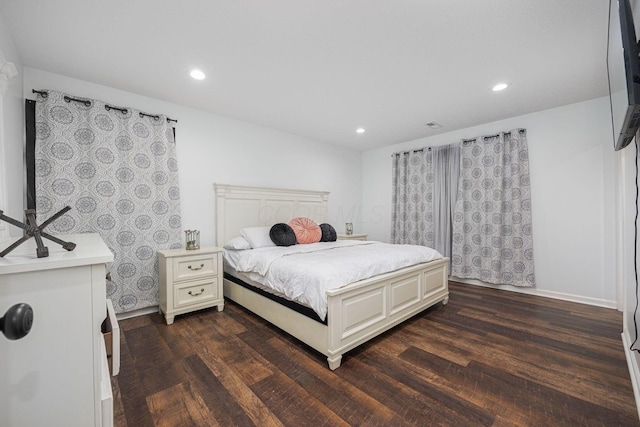 bedroom with dark wood-type flooring