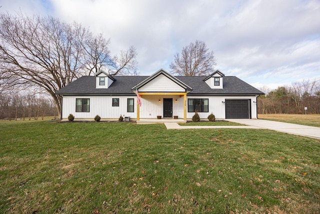 modern farmhouse featuring a garage and a front yard