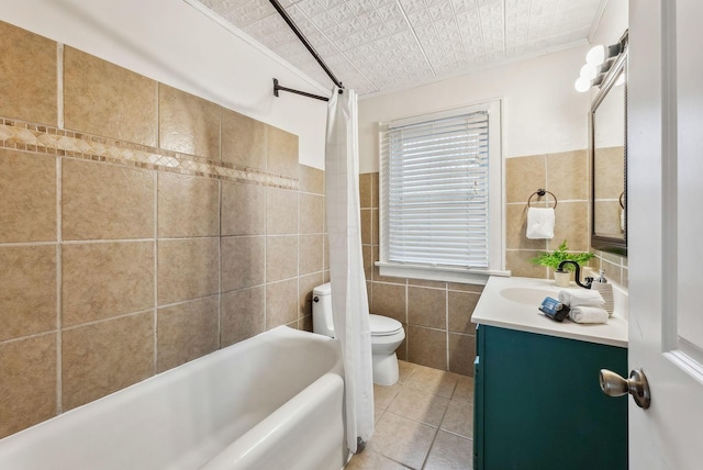 full bathroom featuring tile patterned floors, toilet, tile walls, and shower / bath combo