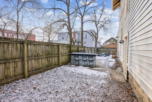 view of yard layered in snow