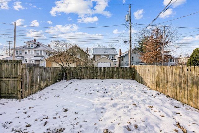 view of yard covered in snow