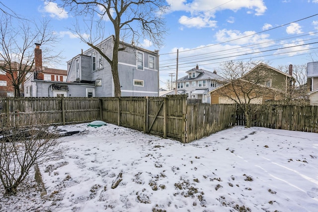 view of yard layered in snow