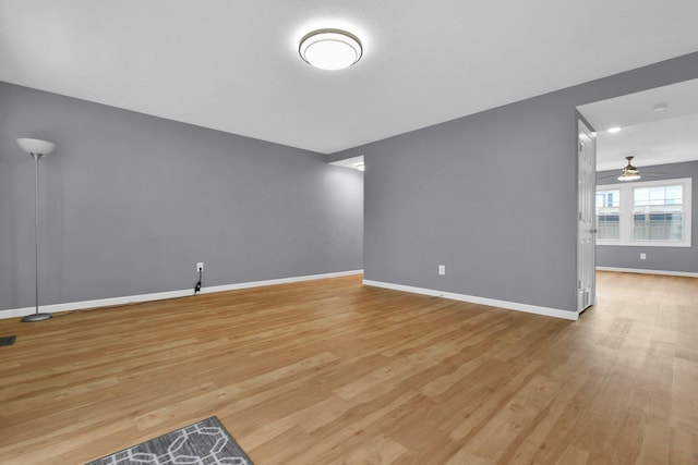 unfurnished living room with light wood-type flooring and ceiling fan