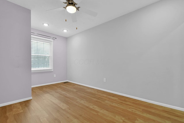 empty room featuring light hardwood / wood-style floors and ceiling fan