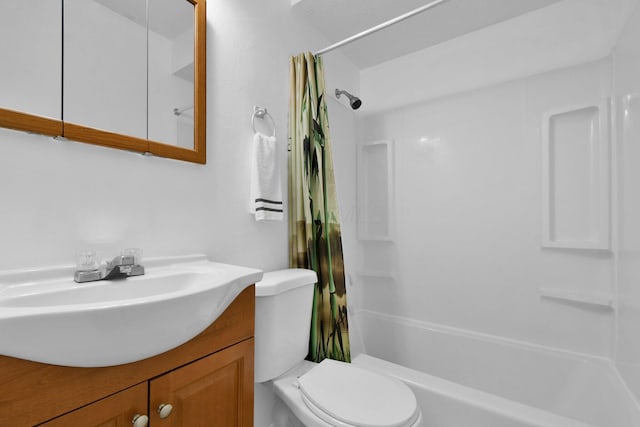 bathroom with toilet, vanity, and curtained shower