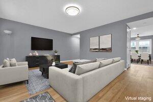 living room with ceiling fan and hardwood / wood-style flooring