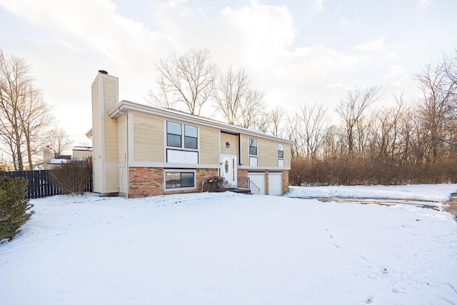 bi-level home featuring a garage